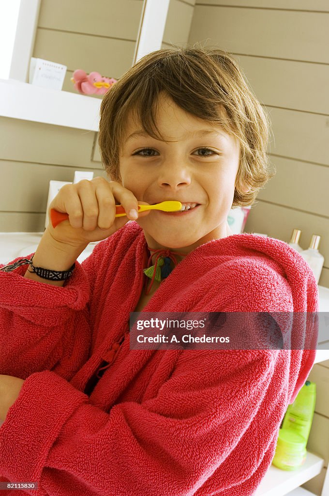 Portrait of a boy brushing his teeth