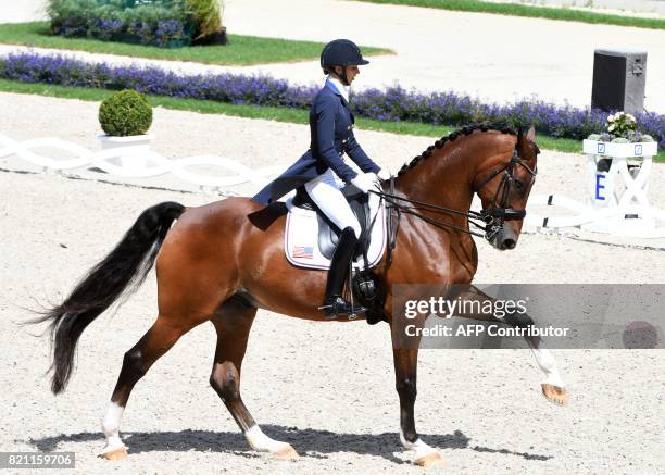 Laura Graves of the US on her horse Verdades competes in the Grand Prix Freestyle CDIO during the World Equestrian Festival CHIO in Aachen Germany on...