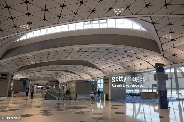 hong kong international airport midfield concourse - hong kong international airport stock pictures, royalty-free photos & images