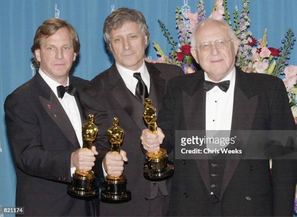 Producers Douglas Wick, left, David Franzoni and Branko Lustig, right, poses with their Oscars during the 73rd Annual Academy Awards March 25, 2001...