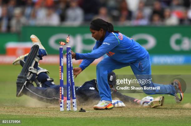 Rajeshwari Gayakwad of India attempts to run out Jenny Gunn of England during the ICC Women's World Cup 2017 Final between England and India at...