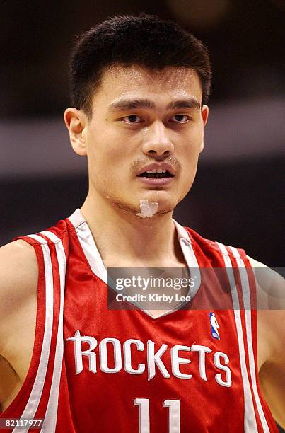 Yao Ming of the Houston Rockets walks onto the court during the NBA game between the Los Angeles Lakers and the Houston Rockets at the Staples Center...