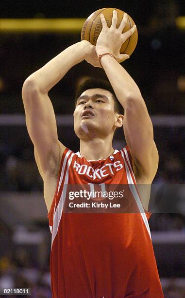 Yao Ming of the Houston Rockets shoots a free throw during the NBA game between the Los Angeles Lakers and the Houston Rockets at the Staples Center...