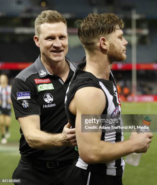 Nathan Buckley, Senior Coach of the Magpies celebrates with Taylor Adams of the Magpies during the 2017 AFL round 18 match between the Collingwood...