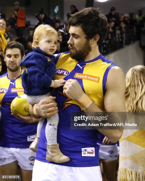 Josh Kennedy of the Eagles walks out with his child ahead of his 200th game during the 2017 AFL round 18 match between the Collingwood Magpies and...