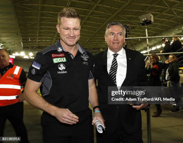 Nathan Buckley, Senior Coach of the Magpies celebrates with Eddie McGuire, President of the Magpies during the 2017 AFL round 18 match between the...