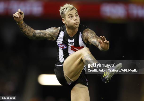 Jamie Elliott of the Magpies kicks a late goal to put Collingwood in front during the 2017 AFL round 18 match between the Collingwood Magpies and the...