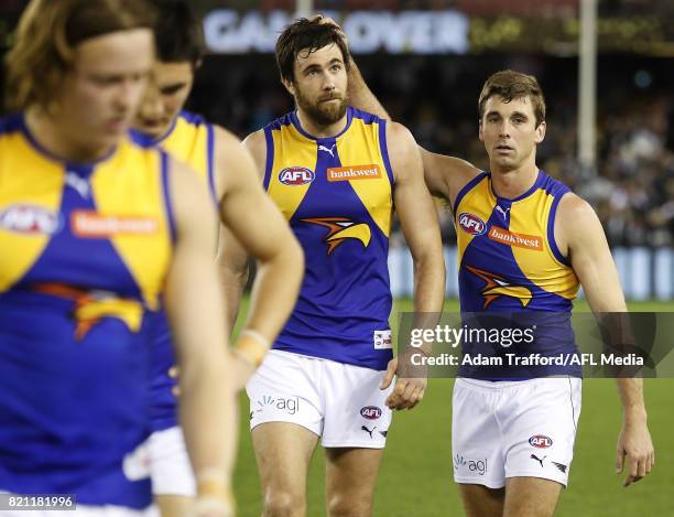 Josh Kennedy and Jamie Cripps of the Eagles look dejected after a loss during the 2017 AFL round 18 match between the Collingwood Magpies and the...