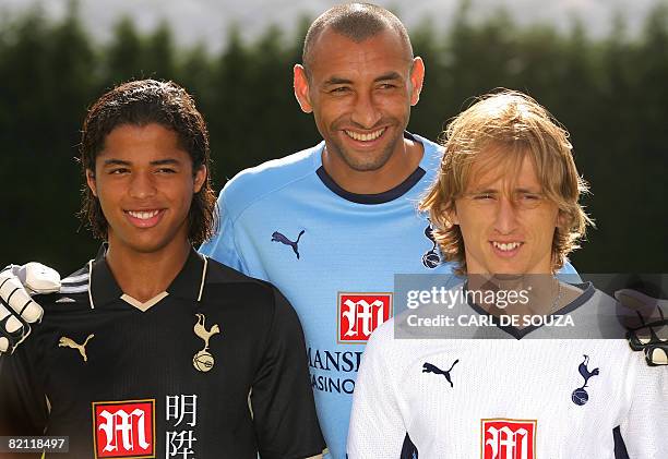 Newly signed Tottenham Hotspur's football players, Mexican Giovani dos Santos , Croatian Luka Modric and Brazilian goalkeeper Heurelho Gomes pose...