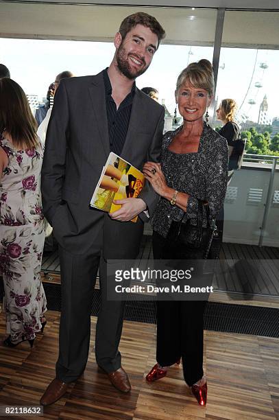 Jan Leeming, wearing ruby slippers, with guest attends the Swarowski pre party to the opening night of The Wizard of Oz at the Royal Festival Hall on...