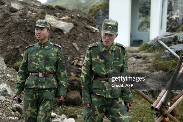 In this photograph taken on July 10 Chinese soldiers stand guard on the Chinese side of the ancient Nathu La border crossing between India and China....