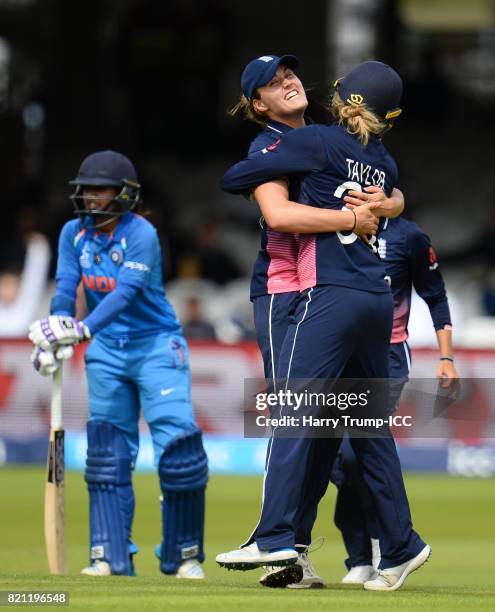 Natalie Sciver of England celebrates with Sarah Taylor of England after running out Mathali Raj of India during the ICC Women's World Cup 2017 Final...