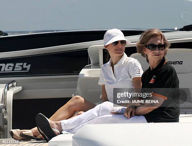 Spain's Princess Letizia and Queen Sofia watch the third day of racing in the Copa del Rey regatta off the coast of Palma de mallorca on July 30,...