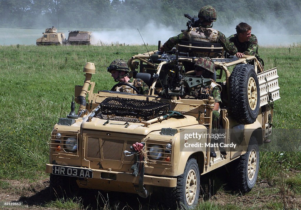Members of 3 Commando watch from their Snatch 2 Land Rover as they ...
