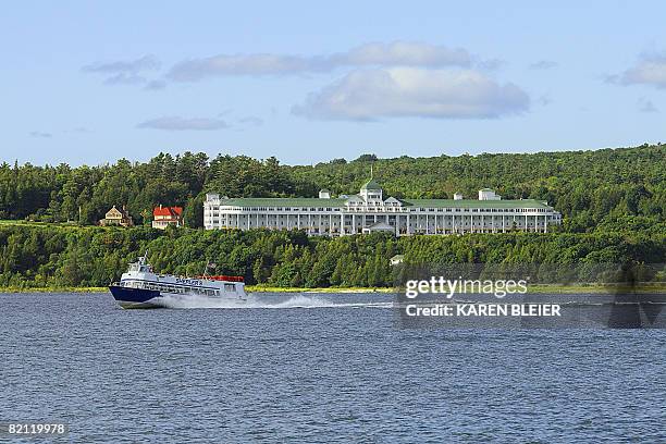 Tour boat speeds past the Grand Hotel on Mackinac Island, MI on July 28,2008. Motorized vehicles have been prohibited on the island since 1898, with...