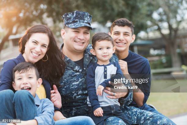 hispanic military man with his family - military family stock pictures, royalty-free photos & images