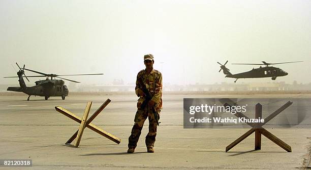 An Iraqi air force soldier stands guard on July 30, 2008 at the New Al Muthana Air Base in Baghdad, Iraq. Iraqi Air Force members demonstrated their...