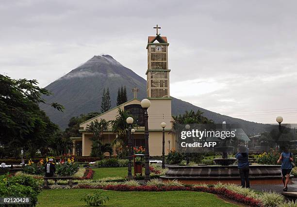 General view of the Arenal vulcano at the back of La Fortuna church on July 29, 2008 in La Fortuna, some 80 km northeast of San Jose. Forty years...