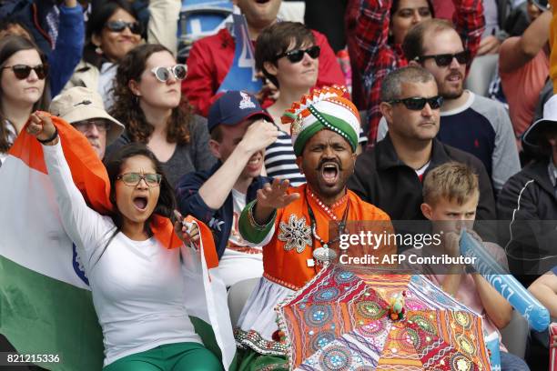 Indian fans cheer on their team during the ICC Women's World Cup cricket final between England and India at Lord's cricket ground in London on July...