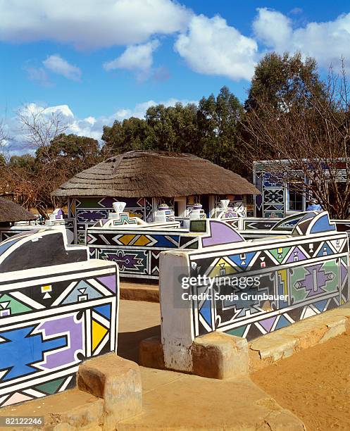 view of traditional ndebele style house and wall, kwazulu natal, south africa - ndebele house stock pictures, royalty-free photos & images