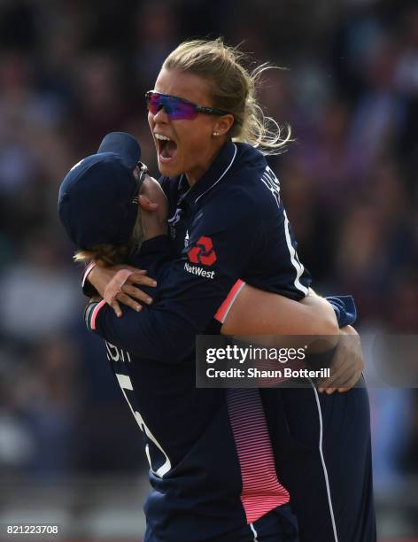 Alex Hartley of England celebrates with captain Heather Knight after taking the wicket of Harmanpreet Kaur of India during the ICC Women's World Cup...