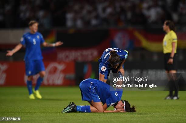 Marta Carissimi of Italy comforts Barbara Bonansea after losing the UEFA Women's Euro 2017 Group B match between Germany and Italy at Koning Willem...
