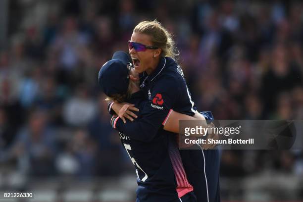 Alex Hartley of England celebrates with captain Heather Knight after taking the wicket of Harmanpreet Kaur of India during the ICC Women's World Cup...