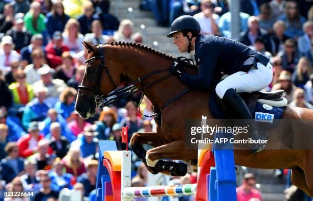 German rider Andreas Kreuzer with his horse Calvilot competes during the jumping competition of the Grand Prix of Aachen during the World Equestrian...