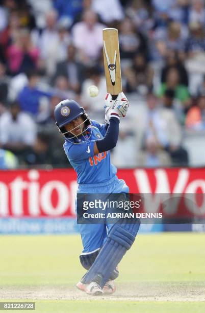 India's Punam Raut hits a four during the ICC Women's World Cup cricket final between England and India at Lord's cricket ground in London on July...
