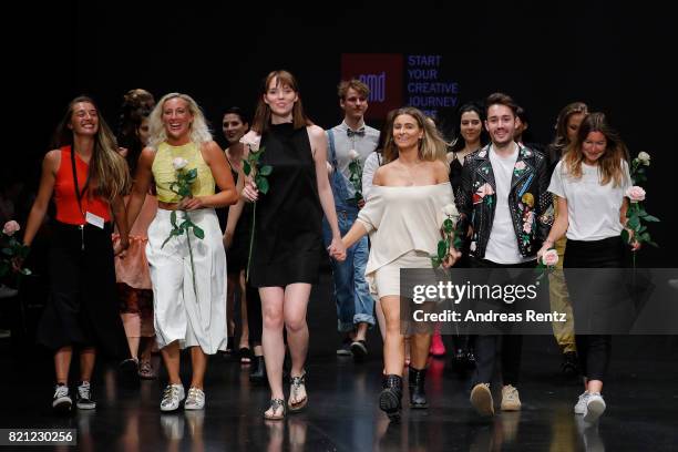 Graduates celebrate on the runway after the AMD Exit.17_2 show during Platform Fashion July 2017 at Areal Boehler on July 23, 2017 in Duesseldorf,...