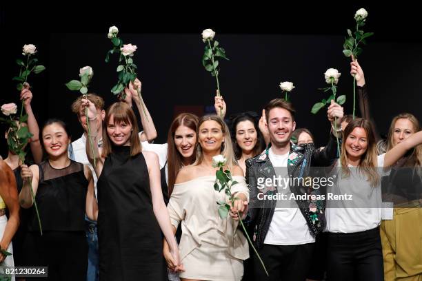 Graduates celebrate on the runway after the AMD Exit.17_2 show during Platform Fashion July 2017 at Areal Boehler on July 23, 2017 in Duesseldorf,...