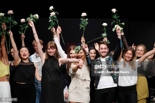 Graduates celebrate on the runway after the AMD Exit.17_2 show during Platform Fashion July 2017 at Areal Boehler on July 23, 2017 in Duesseldorf,...