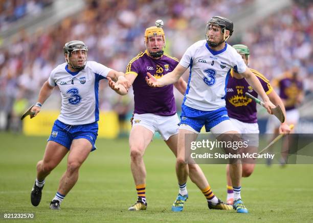 Cork , Ireland - 23 July 2017; Barry Coughlan and his Waterford team-mate Noel Connors, left, in action against Podge Doran, left, and Conor McDonald...