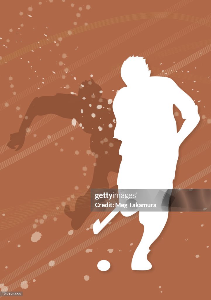 Silhouette of two men playing hockey