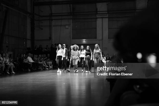 Fashion students walk on the runway at the AMD Exit.17_2 show during Platform Fashion July 2017 at Areal Boehler on July 23, 2017 in Duesseldorf,...