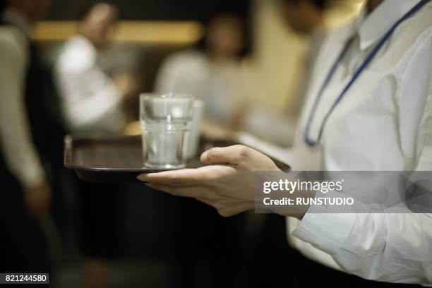 female office worker carrying water to the cup - carrying stock pictures, royalty-free photos & images