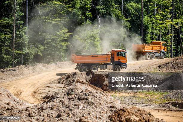 trucks in the open pit mine - quartz sandstone stock pictures, royalty-free photos & images