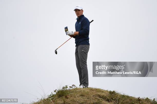 Jordan Spieth of the United States checks the yardage and playing line on the 13th hole during the final round of the 146th Open Championship at...