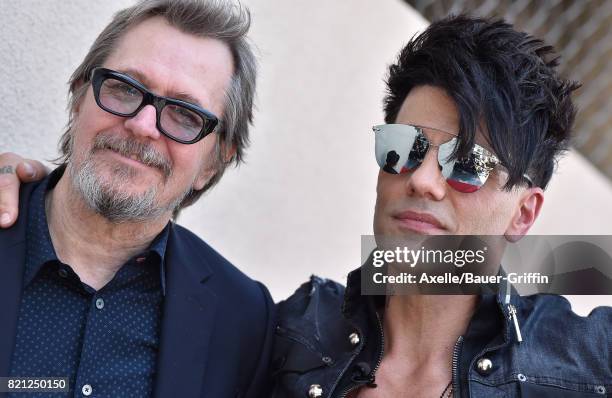 Actor Gary Oldman and magician Criss Angel attend the ceremony honoring Criss Angel with star on the Hollywood Walk of Fame on July 20, 2017 in...