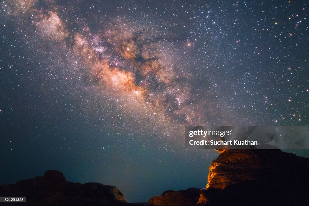 Silhouette of a man looking at the Milky Way Stars shining above the Grand Canyon of Thailand (Sam Phan Bok)