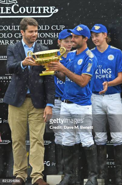 Geoffroy Lefebvre presents Facundo Pieres, Hugo Taylor and Jimbo Fewster of King Power Foxes with the Gold Cup at the Jaeger-LeCoultre Gold Cup Polo...