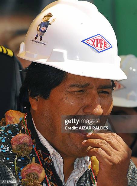 Bolivian President Evo Morales chews coca leaves during a ceremony held with Venezuela's state-owned oil company PDVSA representatives in Patacamaya,...