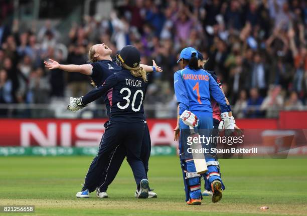 Anya Shrubsole of England celebrates with team-mates Sarah Taylor and Heather Knight after taking the final India wicket of Rajeshwari Gayakwad to...