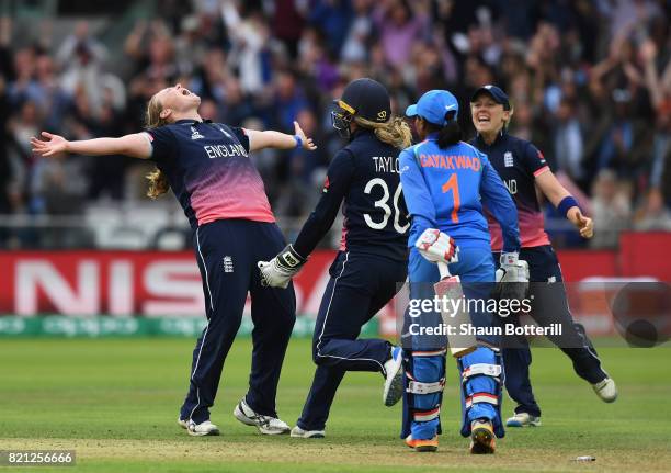 Anya Shrubsole of England celebrates with team-mates Sarah Taylor and Heather Knight after taking the final India wicket of Rajeshwari Gayakwad to...