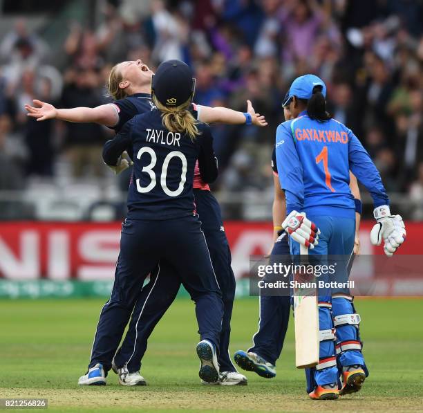 Anya Shrubsole of England celebrates with team-mates Sarah Taylor and Heather Knight after taking the final India wicket of Rajeshwari Gayakwad to...