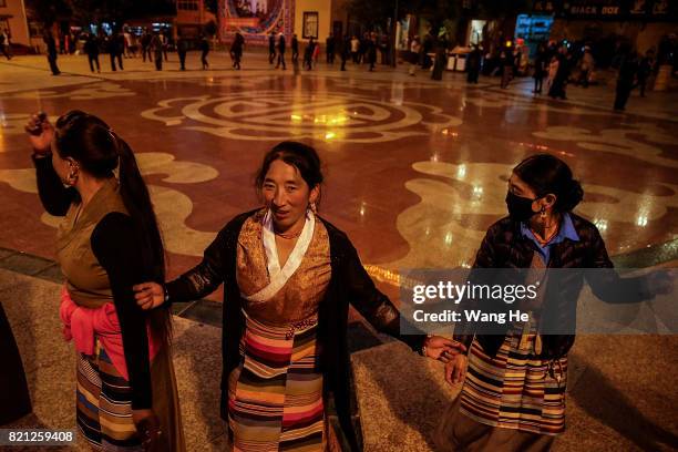 Tibetan women participate in a square dance on July 21 ,2017 in Litang County, Ganzi Tibetan Autonomous Prefecture, Sichuan Province, China. Litang...