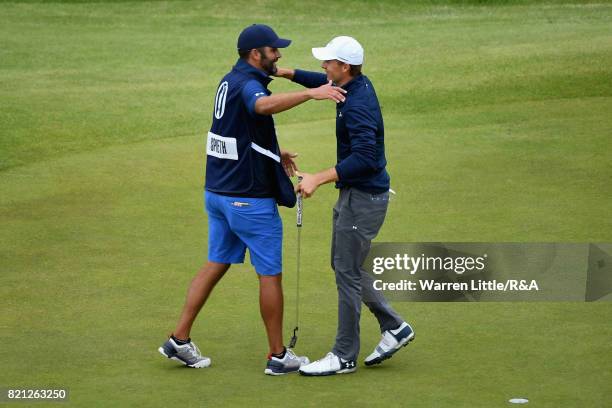 Jordan Spieth of the United States celebrates his victory on the 18th green with caddie Michael Greller during the final round of the 146th Open...