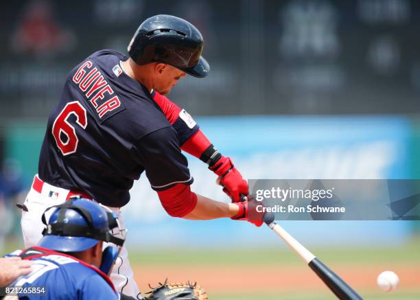 Brandon Guyer of the Cleveland Indians hits a three run double off J.A. Happ of the Toronto Blue Jays during the first inning at Progressive Field on...