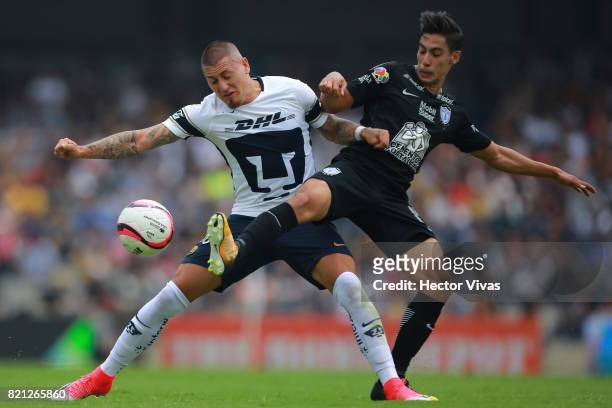 Nicolas Castillo of Pumas struggles for the ball with Erick Aguirre of Pachuca during the 1st round match between Pumas UNAM and Pachuca as part of...