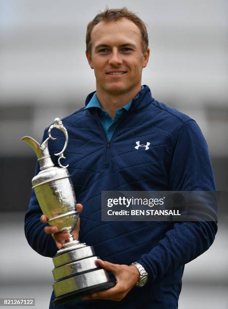 Golfer Jordan Spieth poses for pictures with the Claret Jug, the trophy for the Champion golfer of the year after winning the 2017 British Open Golf...